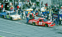 < img src= "Mike Wallace #52 & Robert Pressley #59 pitting.JPG" alt= "2003 NASCAR Craftsman Truck Series, Florida Dodge Dealers 250, at Daytona Speedway" >