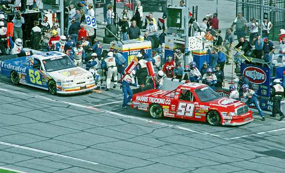 < img src= "Mike Wallace #52 & Robert Pressley #59 pitting.JPG" alt= "2003 NASCAR Craftsman Truck Series, Florida Dodge Dealers 250, at Daytona Speedway" >