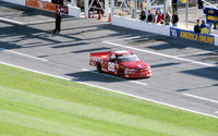 < img src="L.W. Miller #28 pitting .JPG" alt= "2003 NASCAR Craftsman Truck Series, Florida Dodge Dealers 250, at Daytona Speedway" >