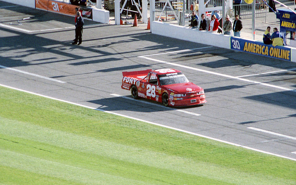 < img src="L.W. Miller #28 pitting .JPG" alt= "2003 NASCAR Craftsman Truck Series, Florida Dodge Dealers 250, at Daytona Speedway" >