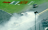 < img src= "Carl Edwards #99 spinning 2.JPG" alt= "2003 NASCAR Craftsman Truck Series, Florida Dodge Dealers 250, at Daytona Speedway" >