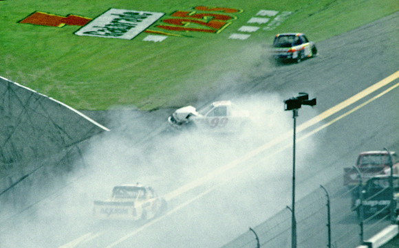 < img src= "Carl Edwards #99 spinning 2.JPG" alt= "2003 NASCAR Craftsman Truck Series, Florida Dodge Dealers 250, at Daytona Speedway" >