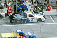 < img src= "Ted Musgrave #3 pitting 1.JPG" alt= "2003 NASCAR Craftsman Truck Series, Florida Dodge Dealers 250, at Daytona Speedway" >