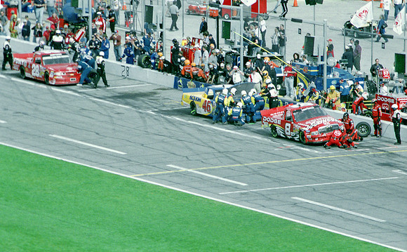 < img src= "Bill Lester #8, L.W. Miller #28, & Dennis Setzer #46 pitting.JPG" alt= "2003 NASCAR Craftsman Truck Series, Florida Dodge Dealers 250, at Daytona Speedway" >