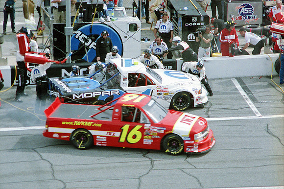 < img src= "Ted Musgrave #1 & Travis Kvapil #16 pitting.JPG" alt= "2003 NASCAR Craftsman Truck Series, Florida Dodge Dealers 250, at Daytona Speedway" >